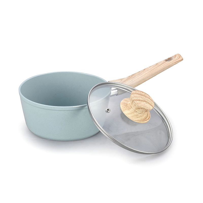 Ceramics y sartenes con utensilios de cocina forjados